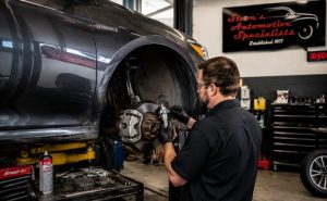 Technician measuring brake components on a vehicle used for rideshare driving near South Towne Center