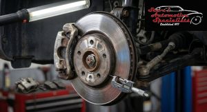 Close-up of a brake rotor being measured, highlighting wear caused by frequent commuter driving